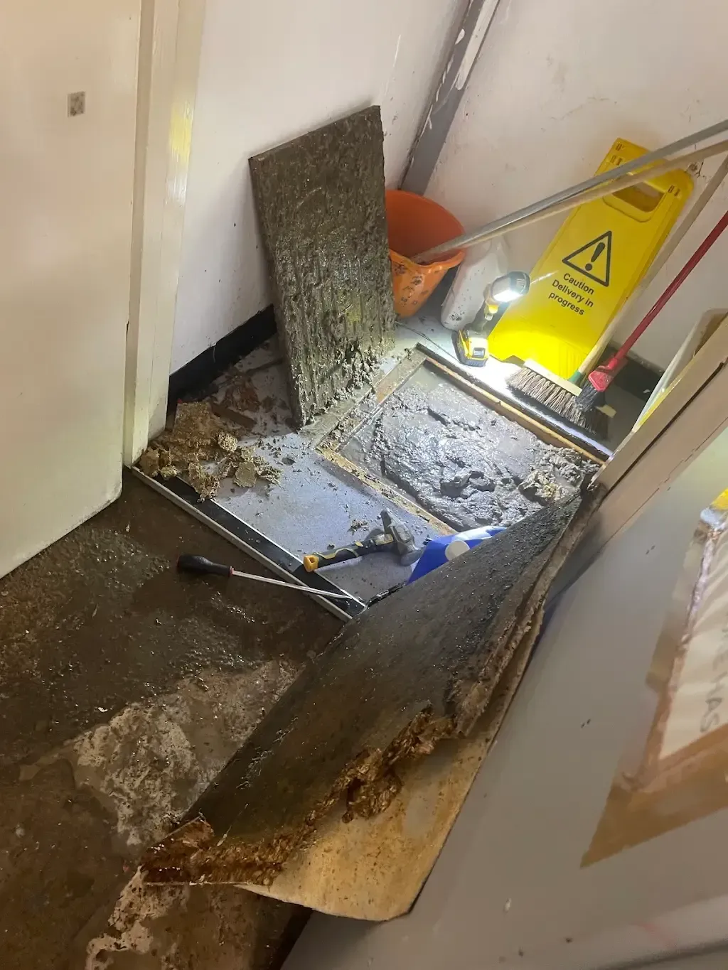 Severe sewage backup overflowing from a blocked drain access point.